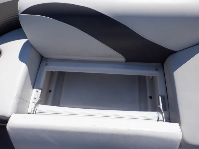 Slide: The Image of 2014 Weeres Cadet Cruise 200 boat seat storage compartment, open and empty. - 17