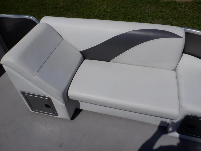 Slide: The Image of 2014 Weeres Cadet Cruise 200 pontoon boat seat with gray and white upholstery. - 18