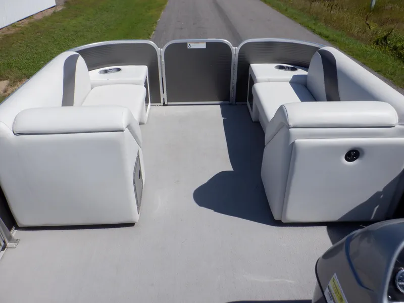 Slide: The Image of 2014 Weeres Cadet Cruise 200 pontoon boat with white seating and open deck layout. - 22