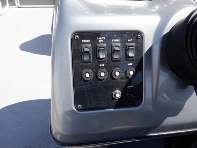 Slide: The Image of Control panel of 2014 Weeres Cadet Cruise 200 pontoon boat with switches and buttons. - 25