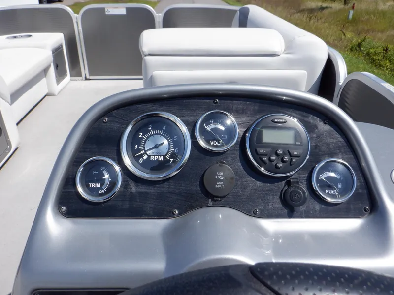 Slide: The Image of 2014 Weeres Cadet Cruise 200 dashboard with gauges and controls. - 26