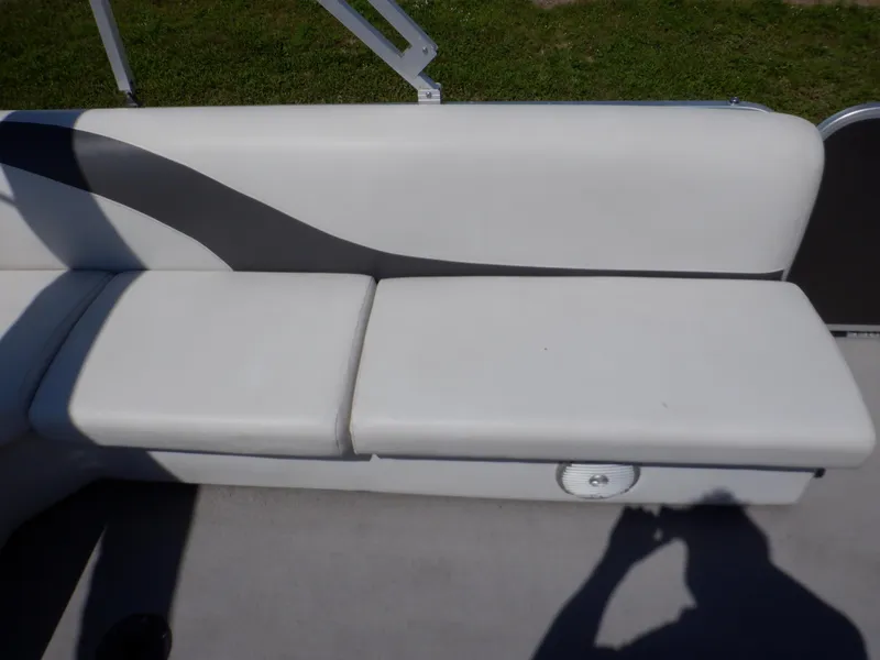 Slide: The Image of 2014 Weeres Cadet Cruise 200 boat seat with white upholstery and storage compartment. - 28