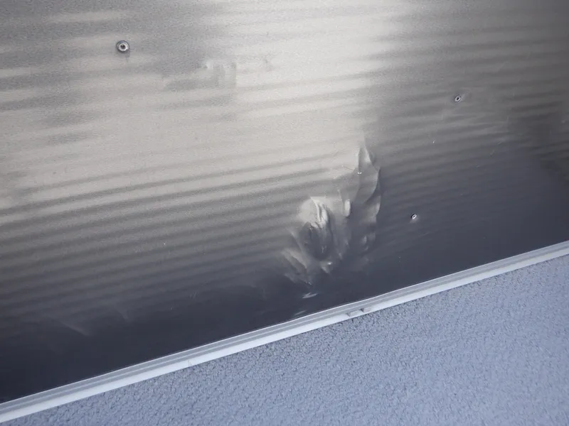 Slide: The Image of 2014 Weeres Cadet Cruise 200 with dented metal panel. - 31