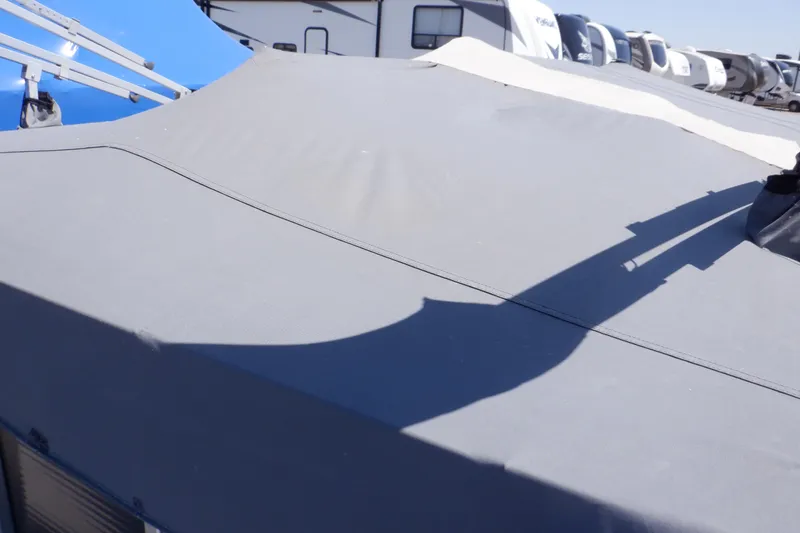 Slide: The Image of 2014 Weeres Cadet Cruise 200 boat with protective cover in storage area. - 38