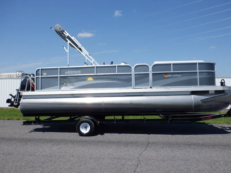 Slide: The Image of 2014 Weeres Cadet Cruise 200 pontoon boat on trailer, parked outdoors. - 5