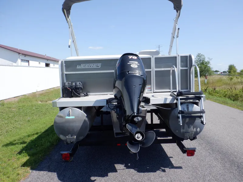 Slide: The Image of 2014 Weeres Cadet Cruise 200 pontoon boat with outboard motor on a sunny day. - 7