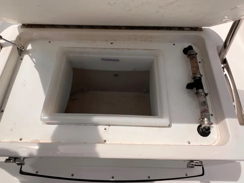 Slide: The Image of Open storage compartment on 2023 Edgewater 170CC boat. - 11