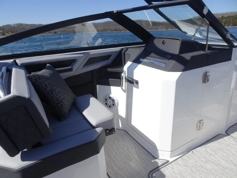 Slide: The Image of 2025 Cobalt R8 boat interior with sleek seating and modern design on a sunny day. - 14