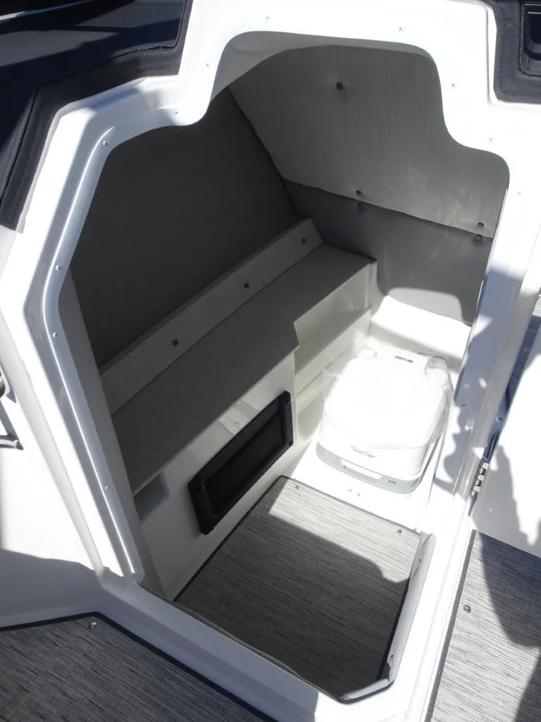 Slide: The Image of 2025 Cobalt R8 boat interior cabin with seating and storage space. - 15