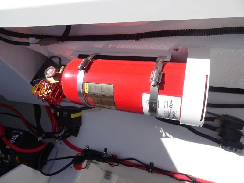 Slide: The Image of Fire extinguisher mounted in a 2025 Cobalt R8 boat engine compartment. - 20