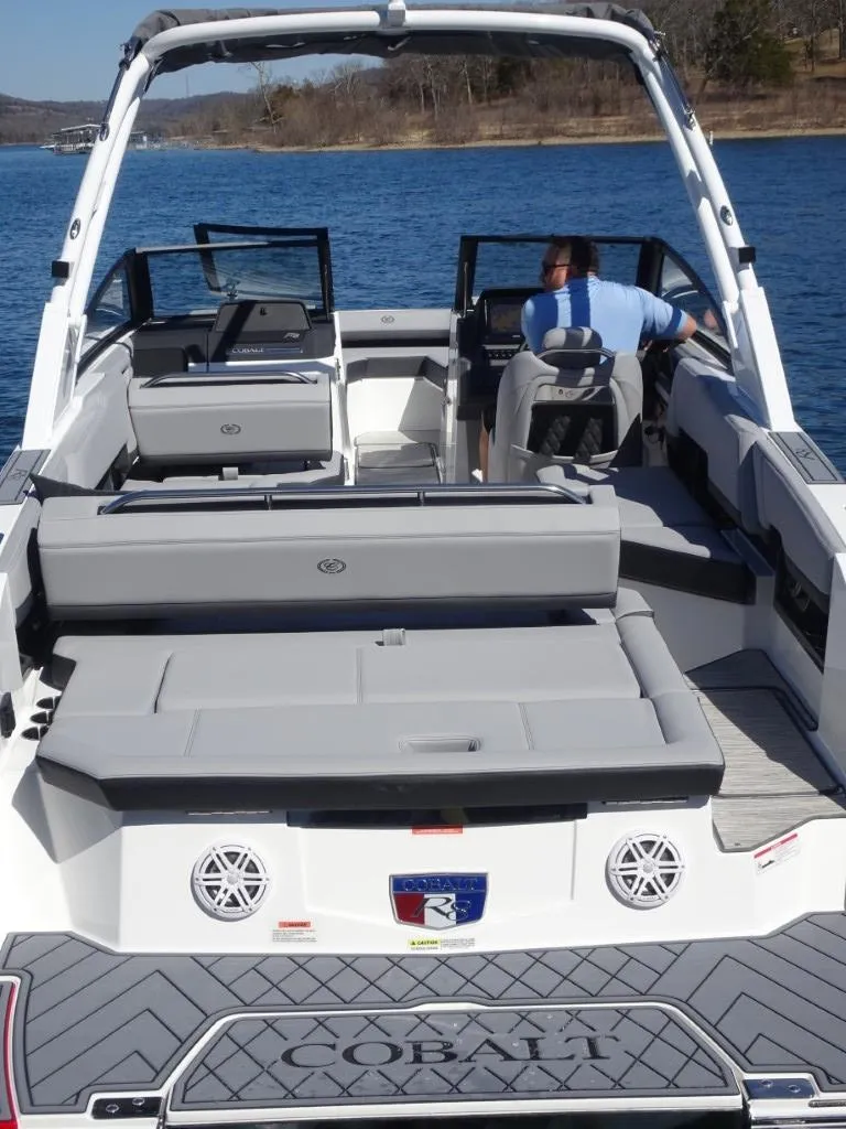 Slide: The Image of 2025 Cobalt R8 boat on water, featuring spacious seating and modern design. - 6