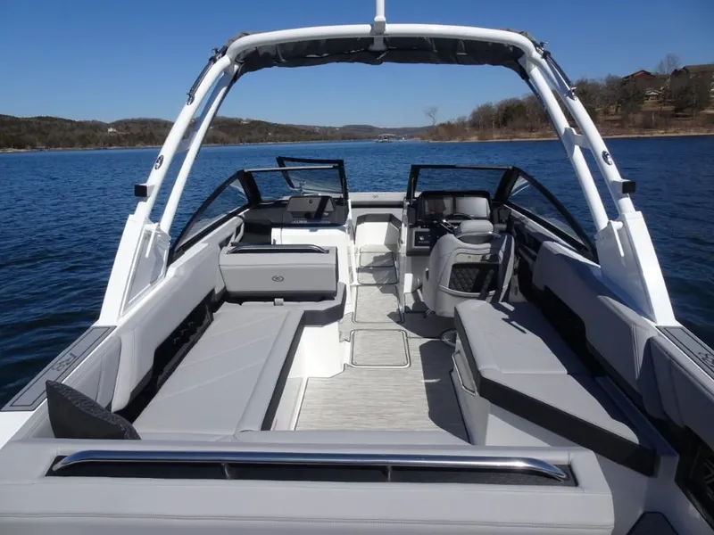 Slide: The Image of 2025 Cobalt R8 boat interior with sleek seating on a serene lake. - 7