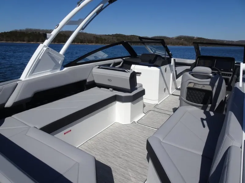 Slide: The Image of 2025 Cobalt R8 boat interior with sleek seating and modern design on a sunny day. - 8