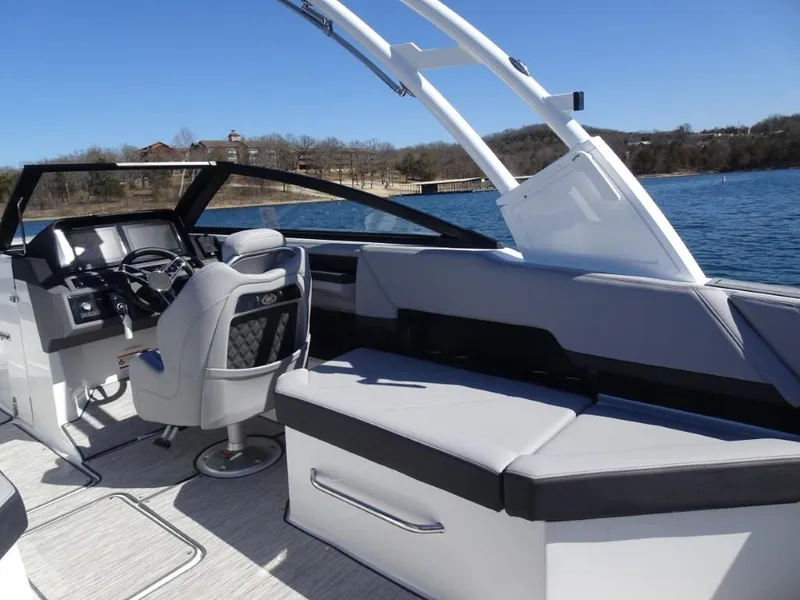 Slide: The Image of Interior of 2025 Cobalt R8 boat with sleek seating and modern dashboard on a sunny day. - 9