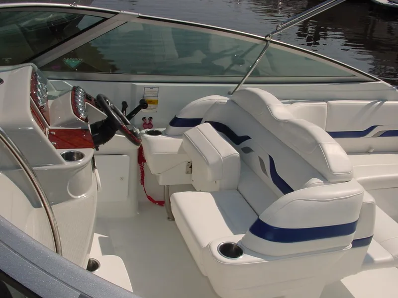 Slide: The Image of 2004 Formula 330 Sun Sport boat interior with white and blue seating. - 15