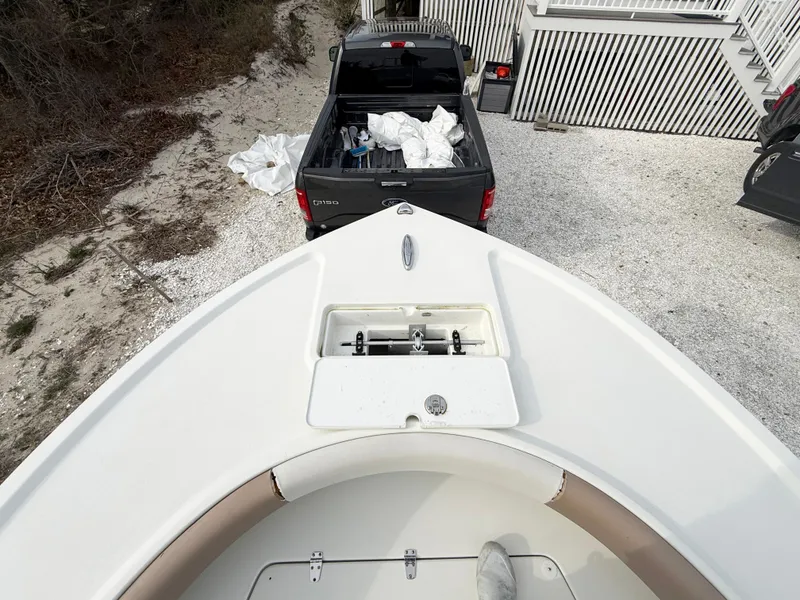 Slide: The Image of Bow of 2019 Parker 23 Special Edition boat with truck in background. - 14