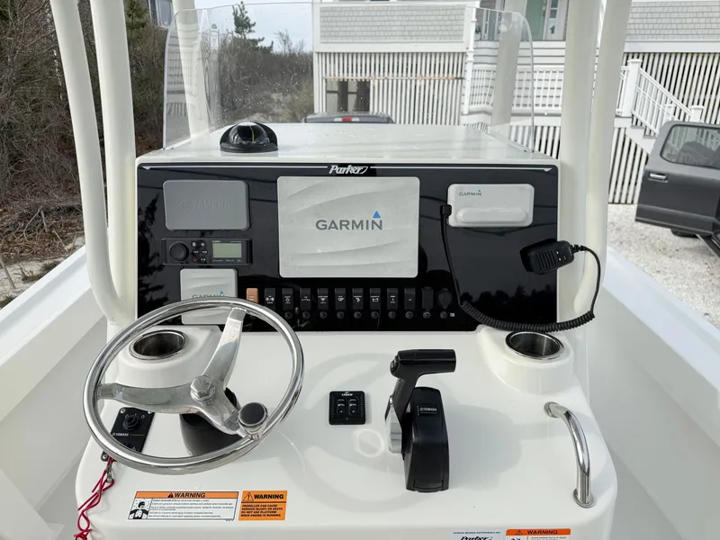 Slide: The Image of 2019 Parker 23 Special Edition boat console with Garmin navigation system and steering wheel. - 5