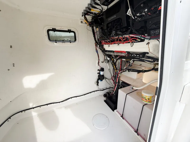 Slide: The Image of Interior of a 2019 Parker 23 Special Edition boat showing wiring and equipment. - 8