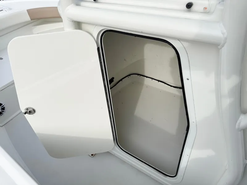 Slide: The Image of Open storage compartment on 2019 Parker 23 Special Edition boat. - 9