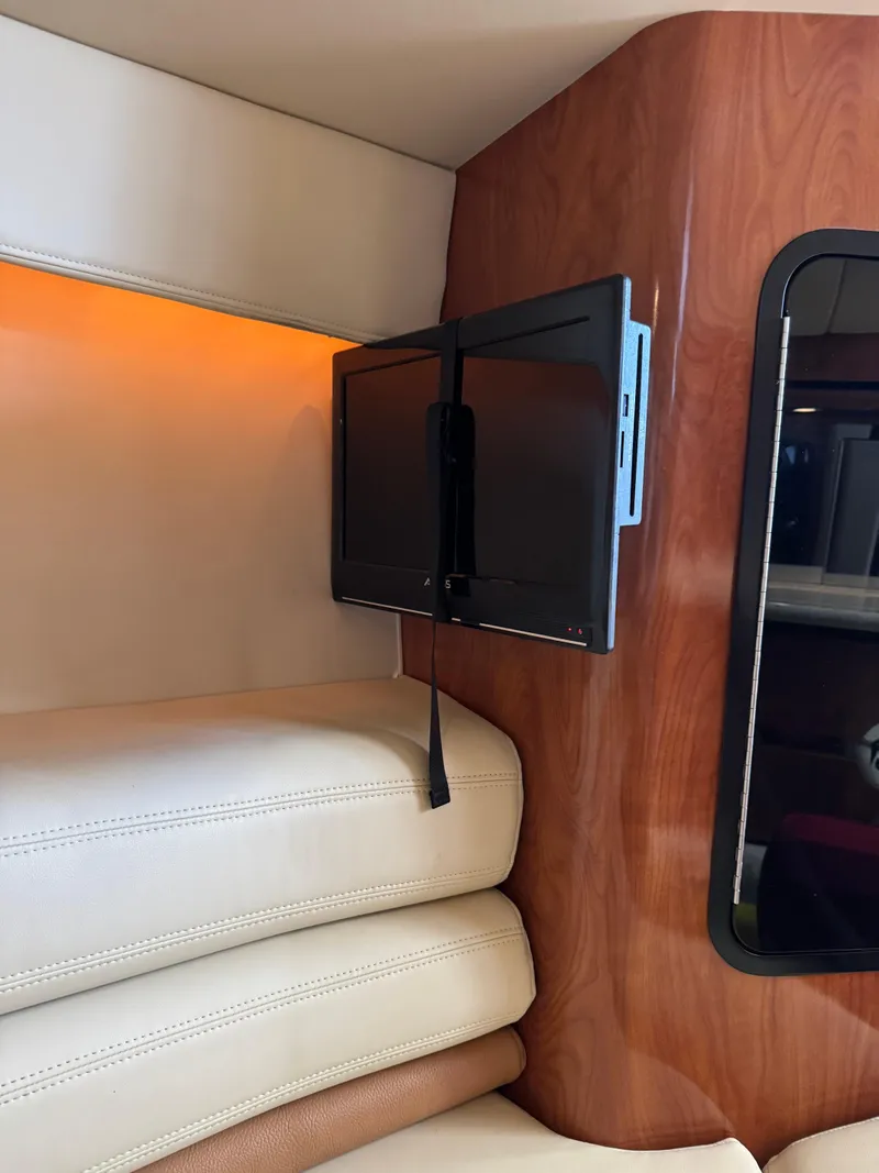 Slide: The Image of 2008 Fountain 38 Lightning interior with mounted TV and leather seating. - 33