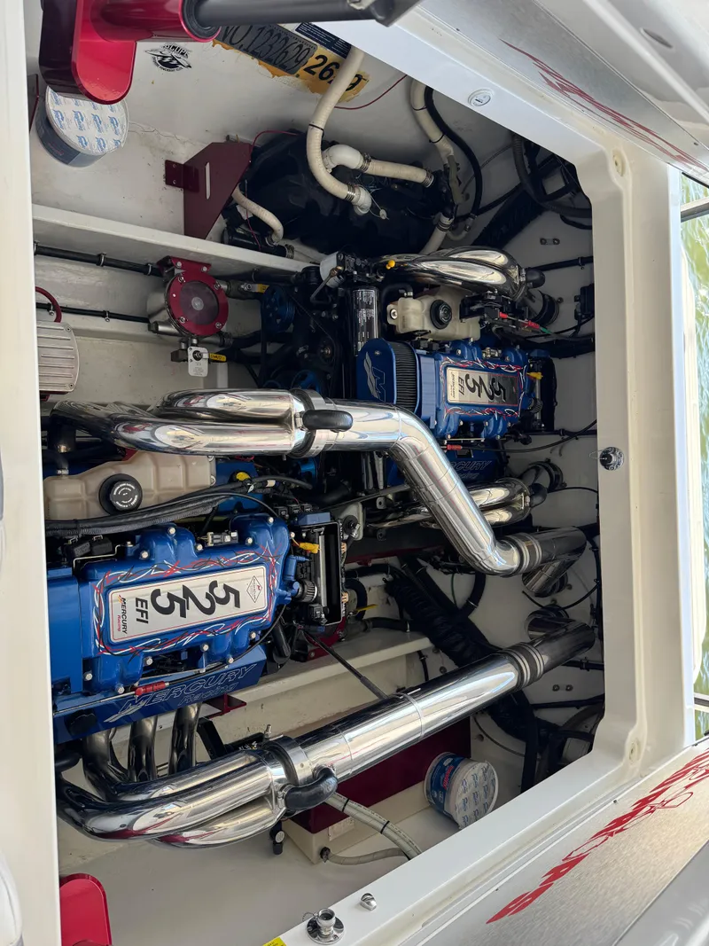 Slide: The Image of Engine compartment of a 2008 Fountain 38 Lightning boat, showcasing dual high-performance engines. - 37