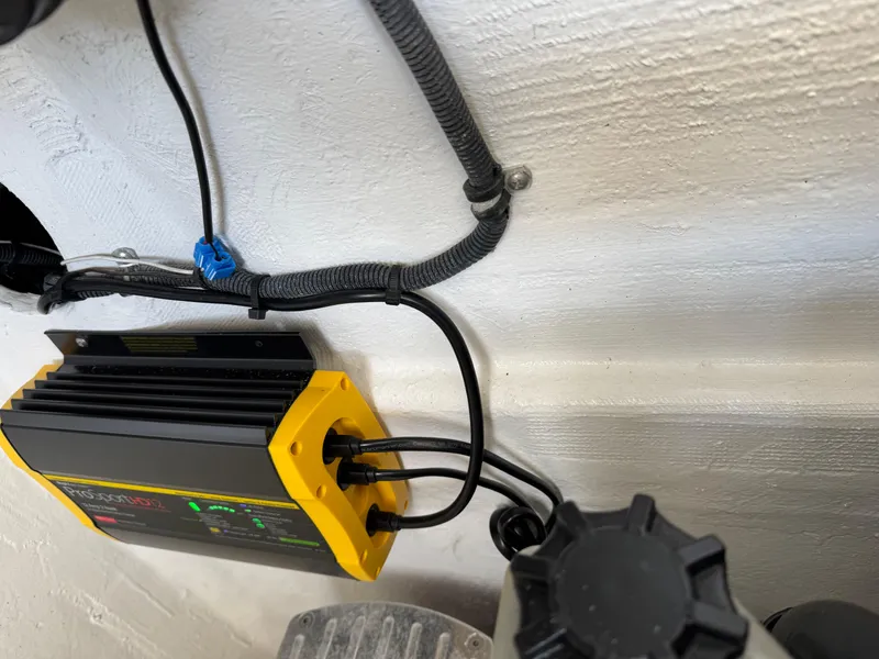 Slide: The Image of Yellow and black electrical device with cables in a 2008 Fountain 38 Lightning boat. - 39