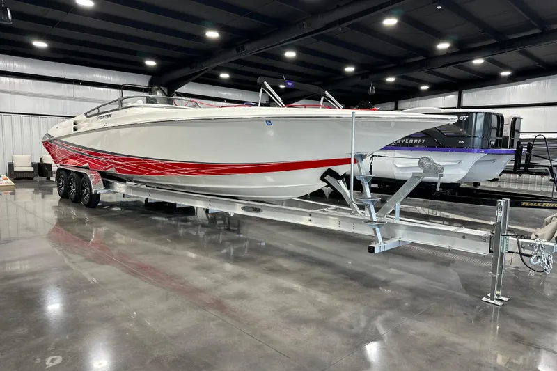 Slide: The Image of 2008 Fountain 38 Lightning boat with red accents on a trailer in a showroom. - 4
