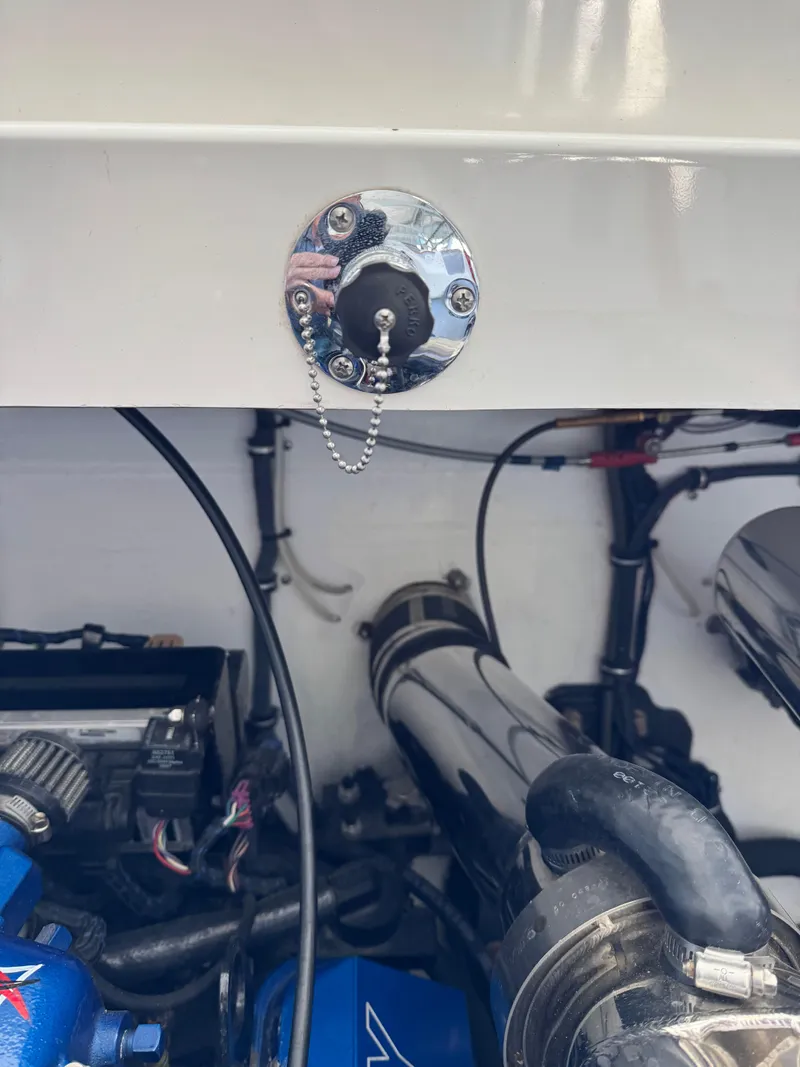 Slide: The Image of Engine compartment of a 2008 Fountain 38 Lightning boat, showcasing mechanical components. - 43