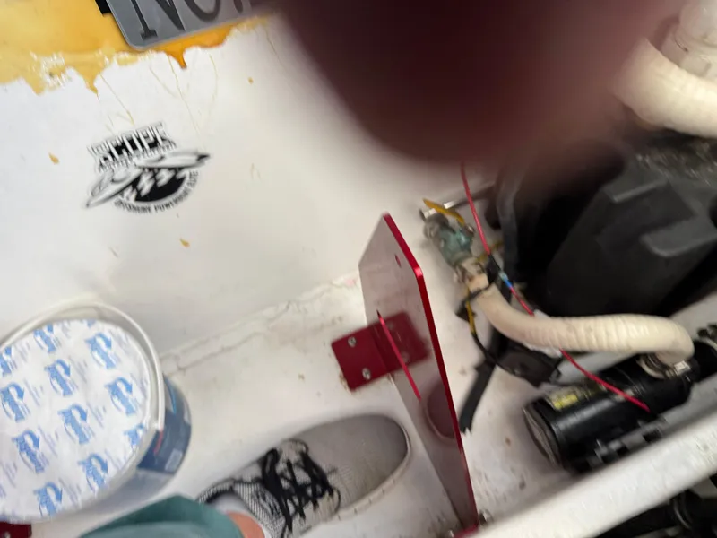 Slide: The Image of Interior view of a 2008 Fountain 38 Lightning boat with visible wiring and components. - 46