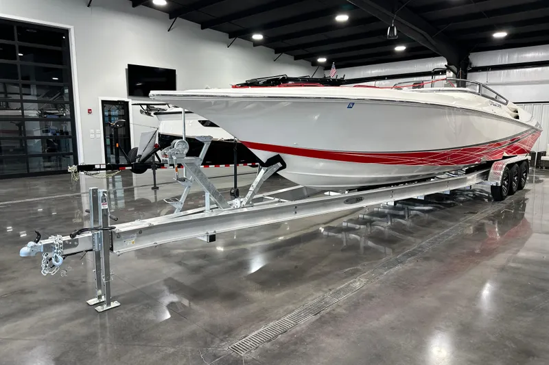 Slide: The Image of 2008 Fountain 38 Lightning speedboat on trailer in a modern showroom. - 5