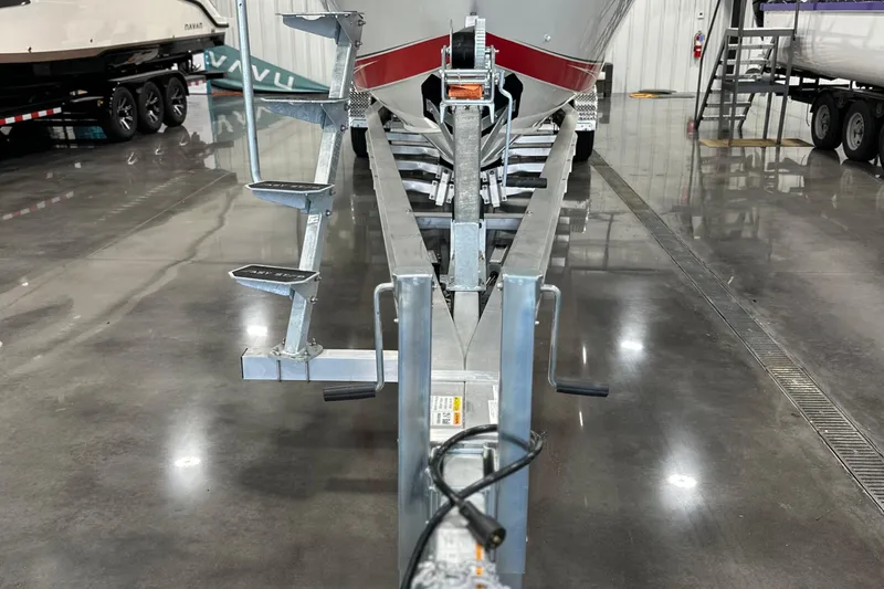 Slide: The Image of 2008 Fountain 38 Lightning boat on trailer in a polished indoor showroom. - 6