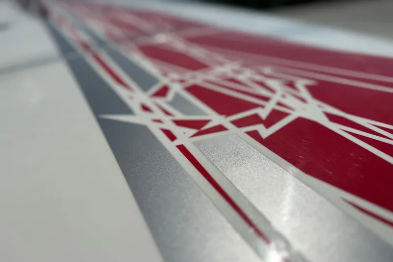 Slide: The Image of Close-up of 2008 Fountain 38 Lightning boat graphics with red and silver geometric design. - 74