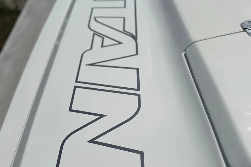 Slide: The Image of Close-up of 2008 Fountain 38 Lightning boat lettering on white surface. - 75