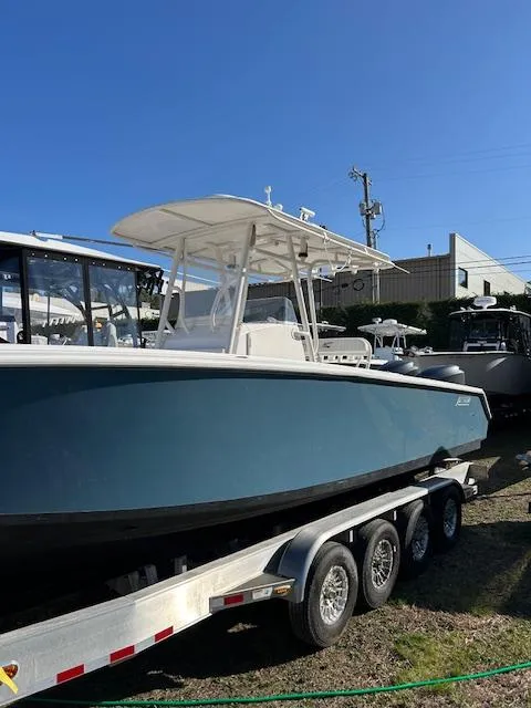 Slide: The Image of 2007 Jupiter 29FS boat on trailer, blue hull, sunny day, outdoor display. - 3