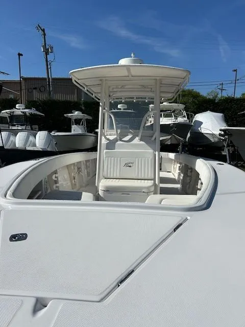 Slide: The Image of 2007 Jupiter 29FS boat with T-top, docked under clear blue sky. - 4