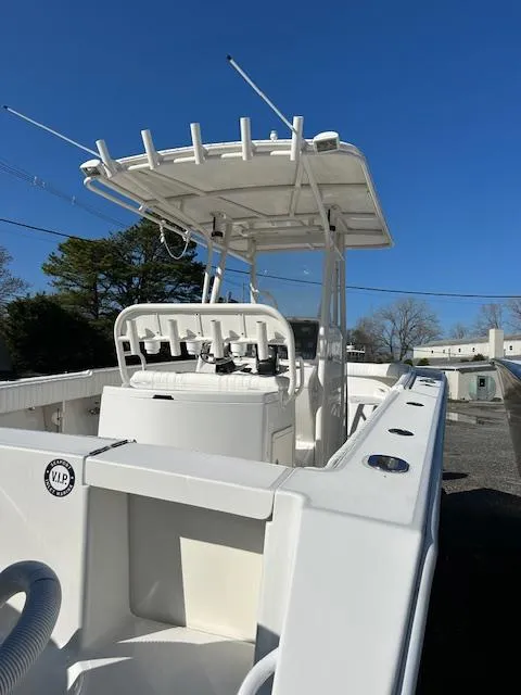 Slide: The Image of 2007 Jupiter 29FS boat with T-top and center console, viewed from the stern. - 5