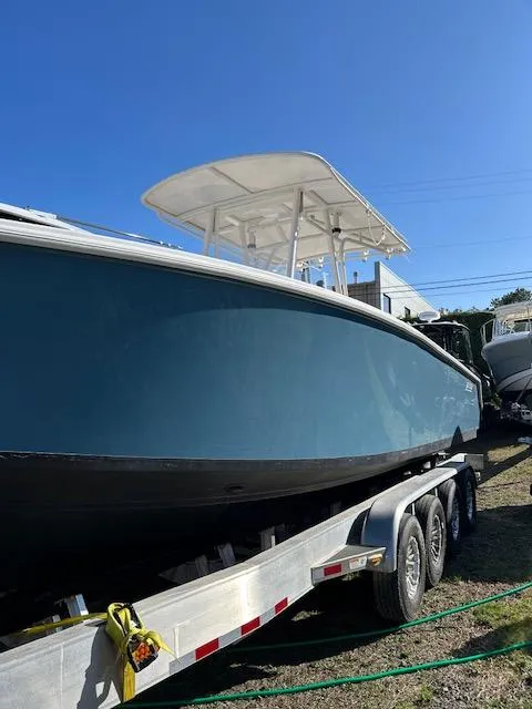 Slide: The Image of 2007 Jupiter 29FS boat on trailer under clear blue sky. - 8