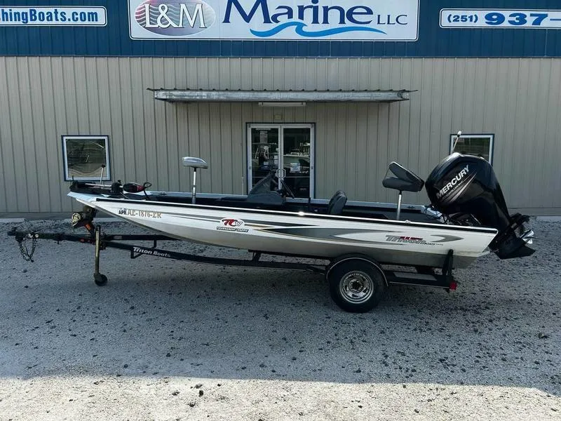 Slide: The Image of 2007 Triton TC-17 boat with Mercury engine, parked outside L&M Marine LLC. - 0
