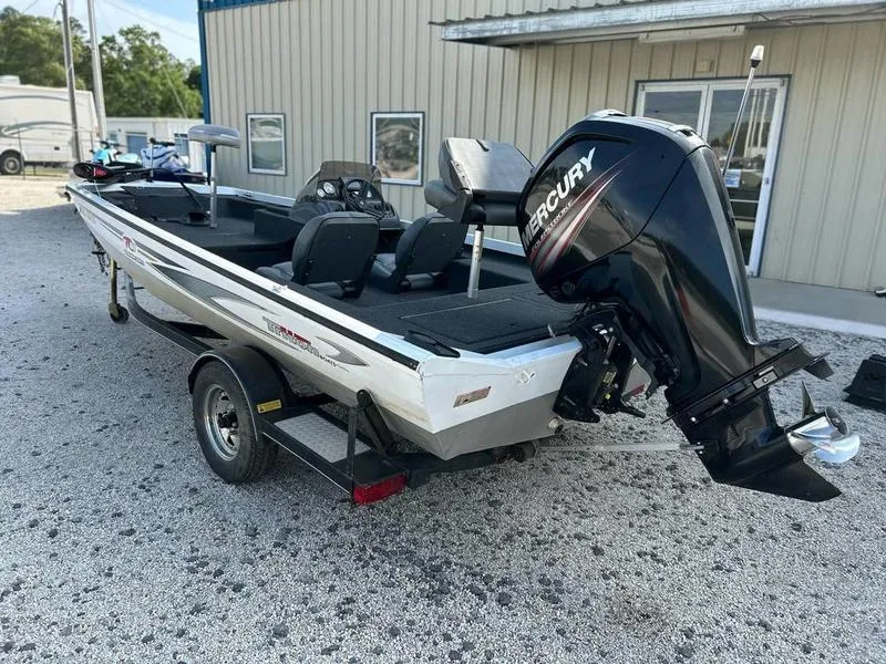 Slide: The Image of 2007 Triton TC-17 boat with Mercury outboard motor on a trailer. - 11