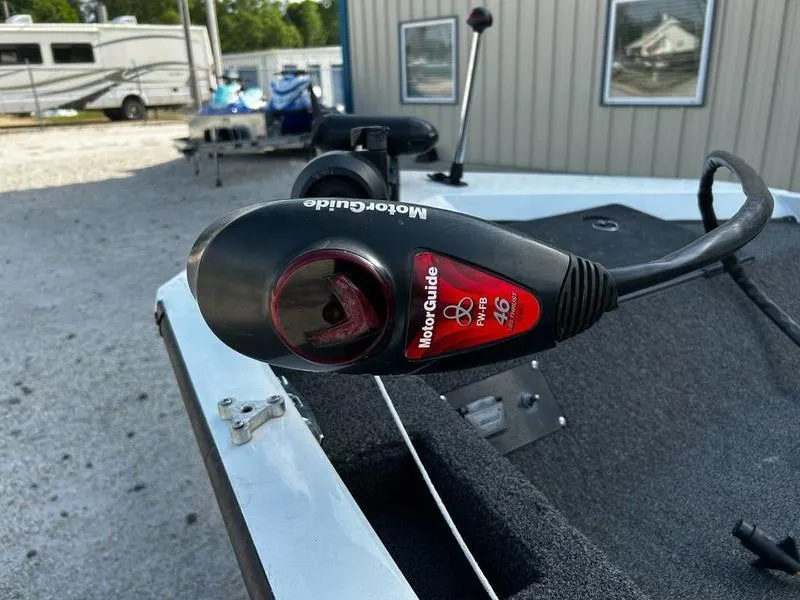 Slide: The Image of Triton TC-17 boat with MotorGuide trolling motor, 2007 model, parked outdoors. - 14