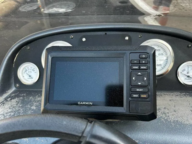 Slide: The Image of Garmin GPS device on Triton TC-17 dashboard, 2007 model, with gauges in the background. - 16