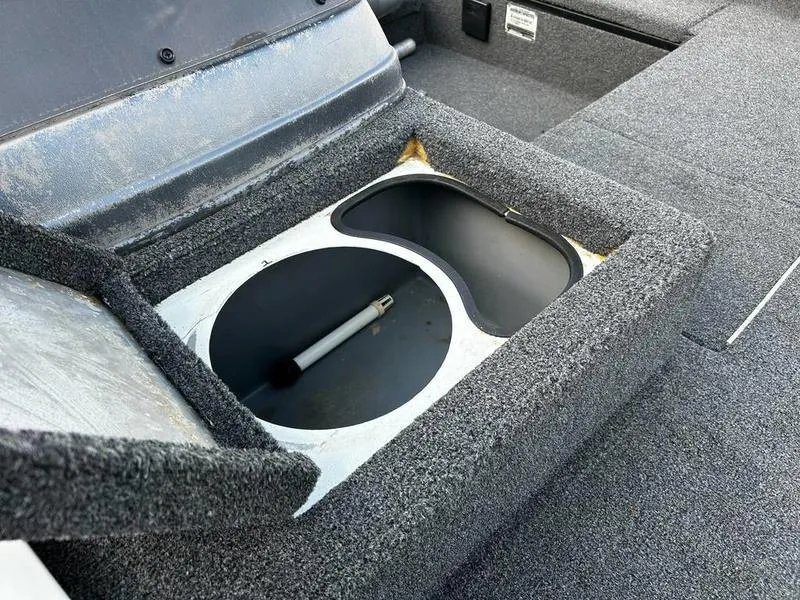 Slide: The Image of 2007 Triton TC-17 boat storage compartment with open lid and visible interior. - 5