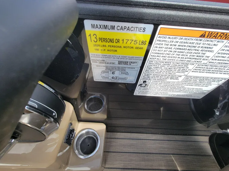 Slide: The Image of 2023 SunChaser Geneva Cruise 24 LR DH capacity label, 13 persons or 1775 lbs, safety warnings. - 18