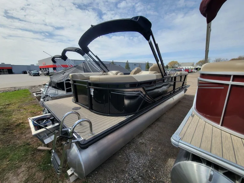 Slide: The Image of 2023 SunChaser Geneva Cruise 24 LR DH pontoon boat with sleek design and comfortable seating. - 3