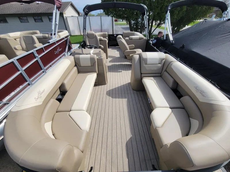 Slide: The Image of 2023 SunChaser Geneva Cruise 24 LR DH pontoon boat with spacious seating and elegant design. - 4