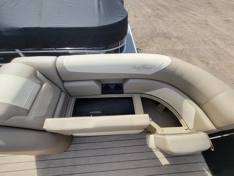 Slide: The Image of 2023 SunChaser Geneva Cruise 24 LR DH boat seating with storage compartments. - 7
