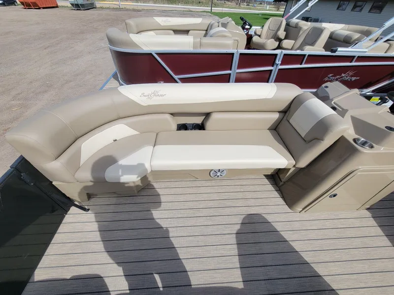 Slide: The Image of 2023 SunChaser Geneva Cruise 24 LR DH pontoon boat with beige seating and deck. - 8