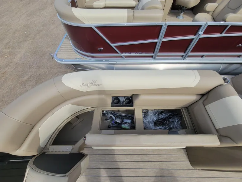 Slide: The Image of 2023 SunChaser Geneva Cruise 24 LR DH pontoon boat interior with storage compartments open. - 9