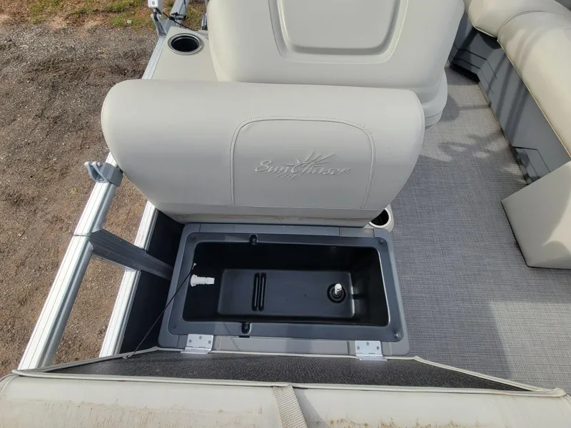 Slide: The Image of 2023 SunChaser Vista 16 Fish boat seat with storage compartment open. - 16