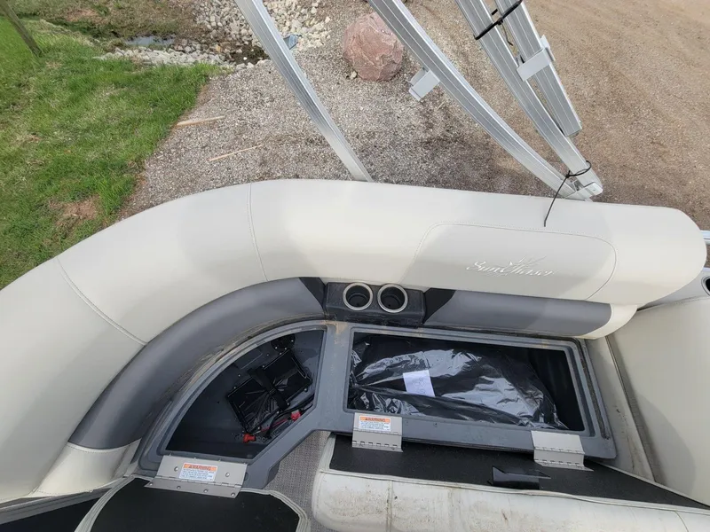 Slide: The Image of 2023 SunChaser Vista 16 Fish boat interior with storage compartment open. - 19